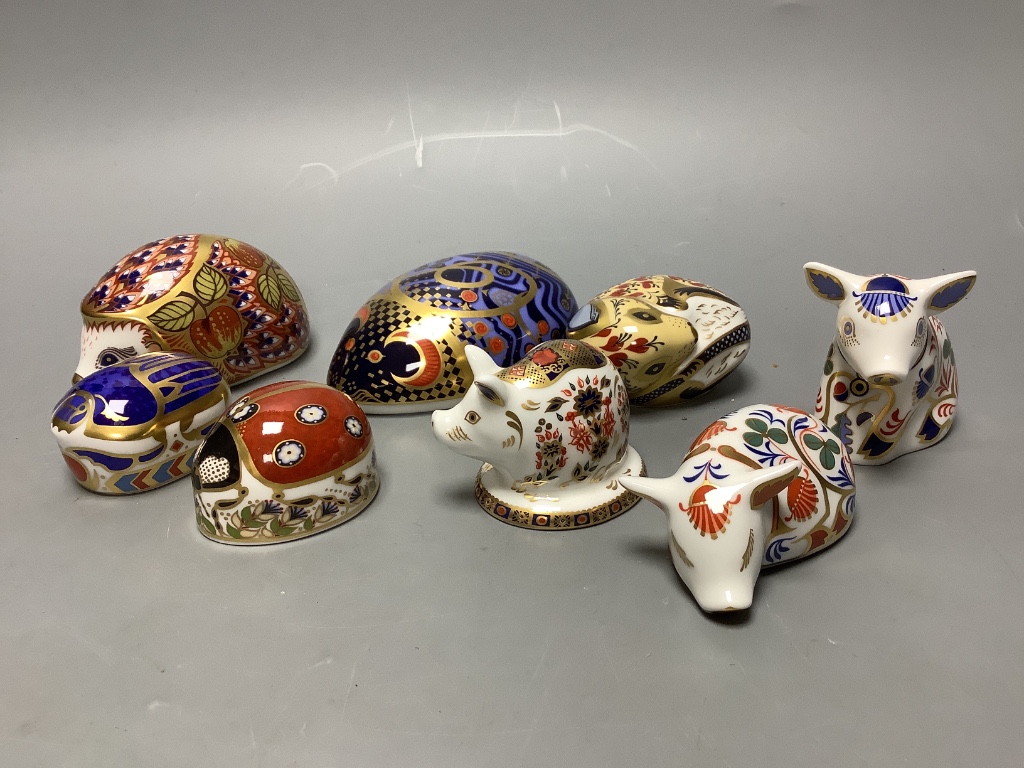 A Royal Crown Derby Collectors Guild Orchard Hedgehog and seven other Royal Crown Derby paperweights